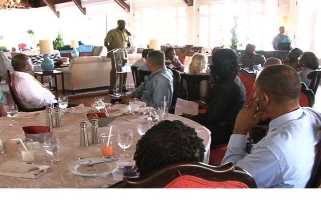 Commissioner of Police Celvin G. Walwyn addresses business personnel at third quarterly luncheon of the Nevis Division of the St. Kitts-Nevis Chamber of Industry and Commerce